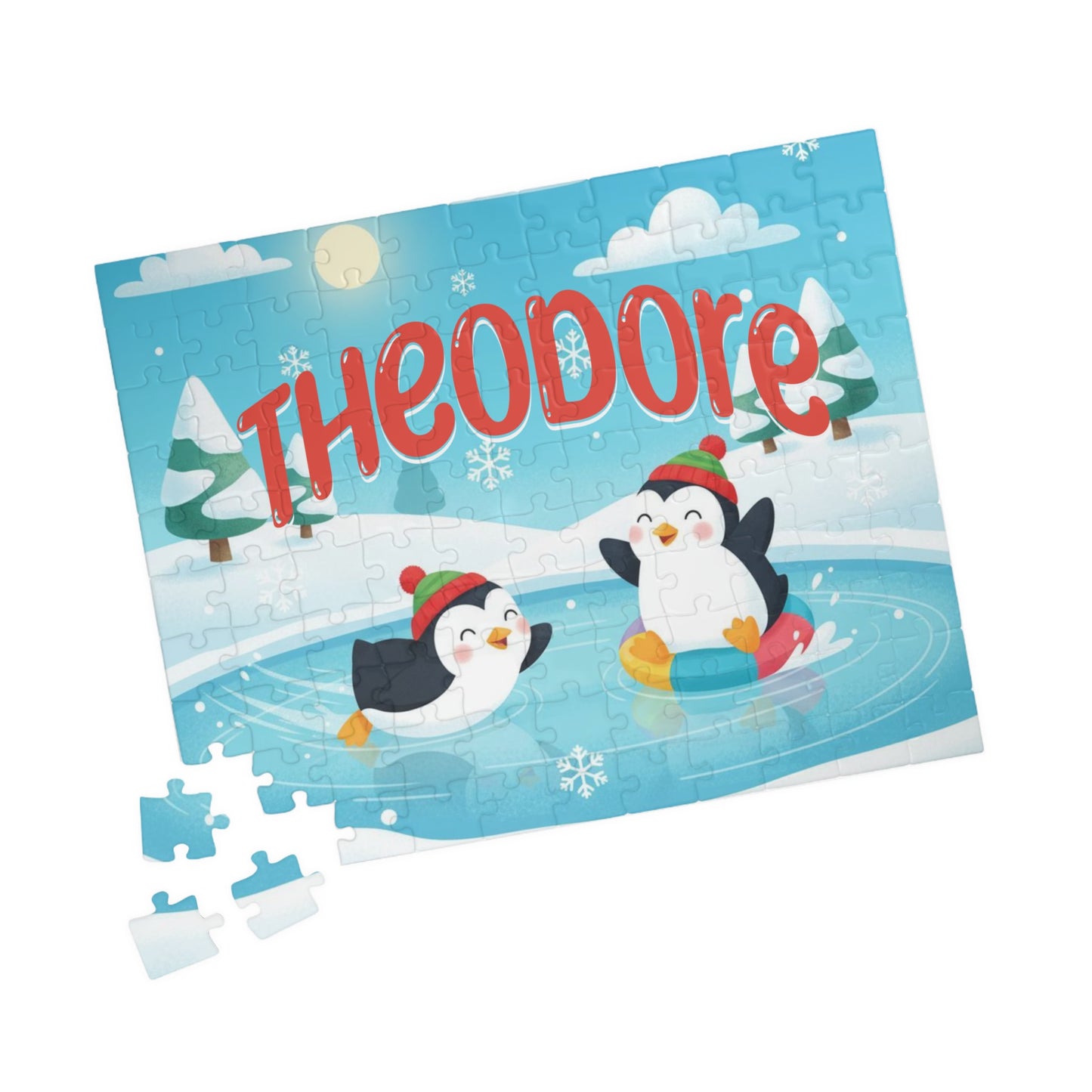 Angled view of a personalized penguin Christmas puzzle with a custom name and loose puzzle pieces beside the completed winter scene.