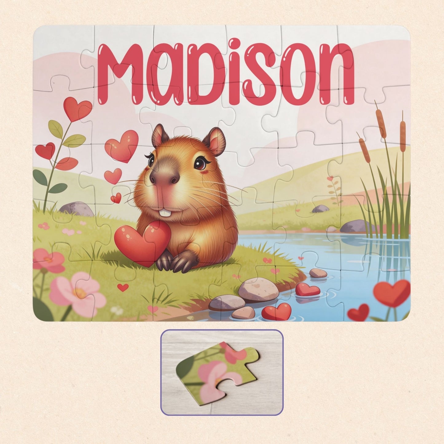 Personalized capybara name puzzle for kids featuring a cute capybara holding hearts in a soft pastel landscape. The child’s name is customizable and appears large across the top of the puzzle (shown as “Madison”), making this a custom 30-piece jigsaw designed for toddlers and young children.