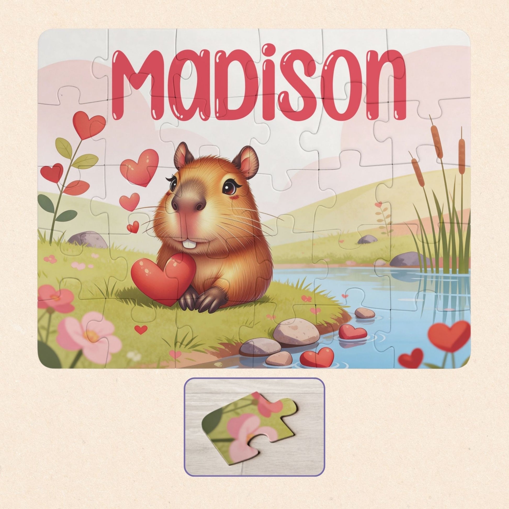 Personalized capybara name puzzle for kids featuring a cute capybara holding hearts in a soft pastel landscape. The child’s name is customizable and appears large across the top of the puzzle (shown as “Madison”), making this a custom 30-piece jigsaw designed for toddlers and young children.