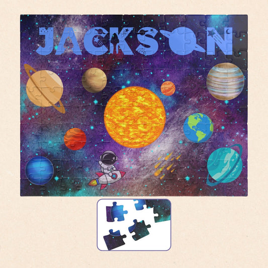 Personalized 110-piece space puzzle for kids featuring a colorful solar system scene with planets, stars, and a cartoon astronaut, customized with the child’s name at the top