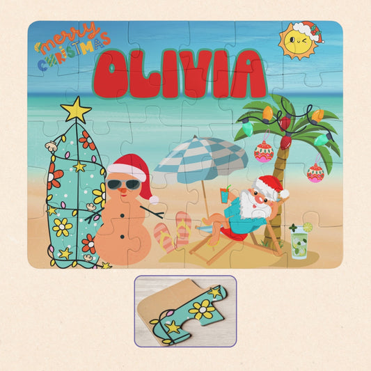 Personalized beach Christmas kids puzzle featuring a Santa relaxing at the beach with palm trees, holiday decorations, and a festive seaside scene. The puzzle includes a customizable name printed prominently across the top and is a 30-piece jigsaw designed for children.
