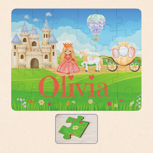 Personalized kids princess jigsaw puzzle with a customizable name displayed across the bottom of the puzzle, featuring a princess, castle, horse carriage, and storybook landscape in a 30-piece format.