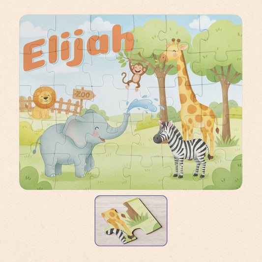 Personalized zoo animal kids puzzle featuring a customizable name at the top, with a cute elephant, giraffe, zebra, lion, and monkey scene
