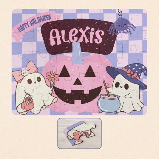 Personalized Halloween jigsaw puzzle for kids featuring a customizable name across the top of the puzzle, illustrated with smiling ghosts and a pumpkin, shown fully assembled with a close-up of one puzzle piece.