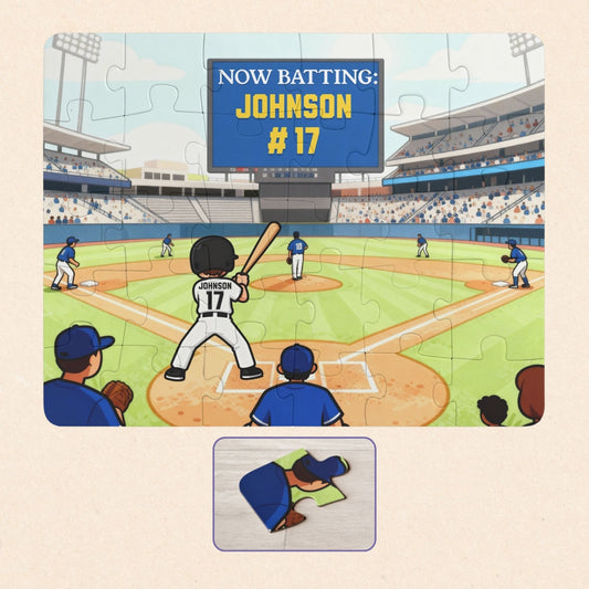Personalized baseball puzzle showing a child standing at home plate in a packed stadium, holding a bat, with a digital scoreboard that reads “Now Batting: Johnson #17.” The player’s name and jersey number can be customized, and the colorful illustrated field includes teammates, fans, and stadium lights.
