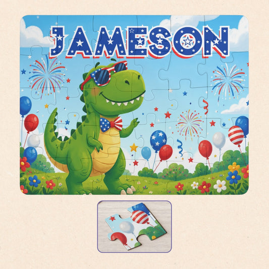 Personalized patriotic dinosaur puzzle featuring a custom name, festive fireworks, balloons, and a smiling dinosaur with patriotic sunglasses and larger puzzle pieces.