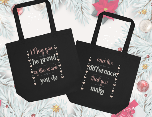 Black Eco-Friendly Tote Bag that has an inspiring message perfect for teachers or therapists. On one side it says "may you be proud of the work you do" and on the other it says "and the difference you make"

